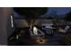 Night view of backyard patio with fire pit and seating area at 9297 E Sundance Cir, Gold Canyon, AZ 85118