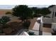 Landscaped backyard with desert plants and a walkway at 9297 E Sundance Cir, Gold Canyon, AZ 85118