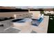 Round spa adjacent to the swimming pool at 9297 E Sundance Cir, Gold Canyon, AZ 85118