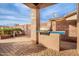 Outdoor kitchen area with built-in grill and patio at 568 N Falcon Dr, Gilbert, AZ 85234