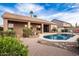 Relaxing backyard with a refreshing pool and a brick patio at 568 N Falcon Dr, Gilbert, AZ 85234