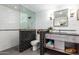 Modern bathroom with walk-in shower, tile flooring, and floating vanity at 568 N Falcon Dr, Gilbert, AZ 85234