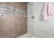 Walk-in shower with neutral tile and modern fixtures at 568 N Falcon Dr, Gilbert, AZ 85234