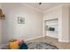 Bedroom with built-in shelves and window at 568 N Falcon Dr, Gilbert, AZ 85234