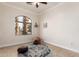 Bright bedroom with large window and tile floor at 568 N Falcon Dr, Gilbert, AZ 85234