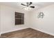 Simple bedroom with large window and ceiling fan at 568 N Falcon Dr, Gilbert, AZ 85234