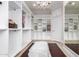 Bright walk-in closet with chandelier and mirror at 568 N Falcon Dr, Gilbert, AZ 85234