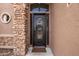Ornate front door with stone accents welcomes you to this beautiful home at 568 N Falcon Dr, Gilbert, AZ 85234
