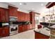 Modern kitchen with stainless steel appliances and ample counter space at 568 N Falcon Dr, Gilbert, AZ 85234