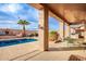 Inviting pool area with covered patio and seating at 568 N Falcon Dr, Gilbert, AZ 85234