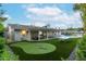 Large backyard with putting green, patio, and ping pong table at 6908 E Mariposa Dr, Scottsdale, AZ 85251