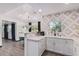 Modern kitchen with white shaker cabinets and geometric backsplash at 6908 E Mariposa Dr, Scottsdale, AZ 85251