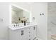 Modern bathroom with a double vanity and marble tile at 6908 E Mariposa Dr, Scottsdale, AZ 85251