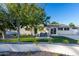 House with attractive landscaping and a seating area at 6908 E Mariposa Dr, Scottsdale, AZ 85251