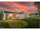 Spacious backyard with pool, putting green, and covered patio at 6908 E Mariposa Dr, Scottsdale, AZ 85251