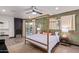 Main bedroom with a gold canopy bed, fireplace, and access to the pool at 6908 E Mariposa Dr, Scottsdale, AZ 85251