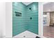 Modern teal shower with a built-in niche at 6908 E Mariposa Dr, Scottsdale, AZ 85251