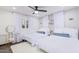 Guest bedroom with two twin beds, a vanity, and light blue accents at 6908 E Mariposa Dr, Scottsdale, AZ 85251
