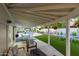 Covered patio with seating area overlooking pool and yard at 6908 E Mariposa Dr, Scottsdale, AZ 85251