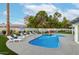 Inviting kidney-shaped pool with lounge chairs and umbrellas at 6908 E Mariposa Dr, Scottsdale, AZ 85251