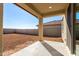 Large backyard with covered patio and block wall at 7499 E Sweet Honey Ln, San Tan Valley, AZ 85143