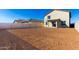 Large backyard with block wall and new home at 7499 E Sweet Honey Ln, San Tan Valley, AZ 85143