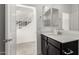 Bathroom with dark vanity and a shower at 7499 E Sweet Honey Ln, San Tan Valley, AZ 85143