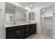 Modern bathroom with double vanity and walk-in shower at 7499 E Sweet Honey Ln, San Tan Valley, AZ 85143