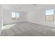 Bright bedroom featuring carpet flooring and large windows at 7499 E Sweet Honey Ln, San Tan Valley, AZ 85143