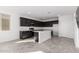 Modern kitchen featuring dark cabinetry and an island at 7499 E Sweet Honey Ln, San Tan Valley, AZ 85143