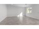 Living room with tile floors and sliding glass doors at 7499 E Sweet Honey Ln, San Tan Valley, AZ 85143