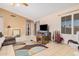 Living room features a neutral color palette, comfy seating, and access to other rooms at 10014 N 66Th Ln, Glendale, AZ 85302