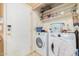 Laundry room with washer, dryer, and shelving at 10014 N 66Th Ln, Glendale, AZ 85302