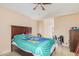 Bedroom with wood floors, ceiling fan, and ample closet space at 10014 N 66Th Ln, Glendale, AZ 85302