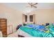Spacious bedroom with tile floors, ceiling fan, and ample closet space at 10014 N 66Th Ln, Glendale, AZ 85302