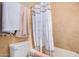 Bathroom with shower/tub combo and tile surround at 10014 N 66Th Ln, Glendale, AZ 85302
