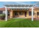 Covered patio with artificial turf and a pergola at 14233 W Via Manana --, Sun City West, AZ 85375