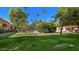 Community features a grassy lawn and swimming pool at 353 E Thomas Rd # C405, Phoenix, AZ 85012