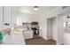 Modern white kitchen with stainless steel appliances and patterned backsplash at 353 E Thomas Rd # C405, Phoenix, AZ 85012