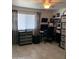 Bright bedroom with tile floors, a workspace, and ample storage at 272 Leisure World --, Mesa, AZ 85206