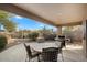 Covered patio with seating area and built-in grill at 9220 E Whitethorn Cir, Scottsdale, AZ 85266