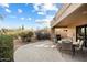 Covered patio with seating area and built-in grill at 9220 E Whitethorn Cir, Scottsdale, AZ 85266