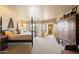 Main bedroom with king-size bed and access to private balcony at 9220 E Whitethorn Cir, Scottsdale, AZ 85266