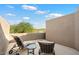 Private balcony with seating for two and scenic views at 9220 E Whitethorn Cir, Scottsdale, AZ 85266
