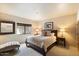 Guest bedroom with queen-size bed and chaise lounge at 9220 E Whitethorn Cir, Scottsdale, AZ 85266