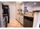 Modern kitchen with granite countertops and stainless steel appliances at 2025 E Campbell Ave # 330, Phoenix, AZ 85016