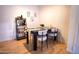 Modern dining area with four chairs and a stylish shelving unit at 2025 E Campbell Ave # 330, Phoenix, AZ 85016