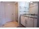 Clean bathroom with granite vanity and glass shelving at 2025 E Campbell Ave # 330, Phoenix, AZ 85016