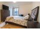 Spacious bedroom with a dresser, bed, and large window at 2025 E Campbell Ave # 330, Phoenix, AZ 85016