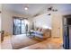 Bright living room featuring hardwood floors and access to a balcony at 2025 E Campbell Ave # 330, Phoenix, AZ 85016